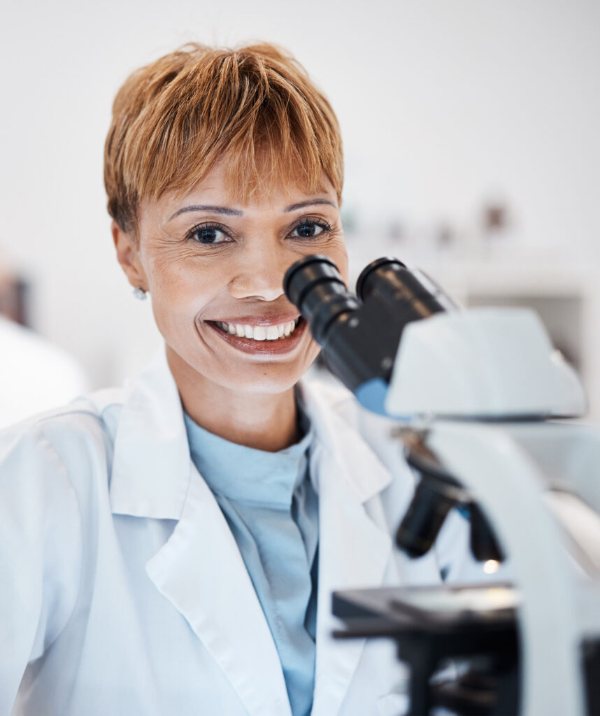 Woman, medical science and portrait with a microscope in a laboratory for research, analysis and study. Mature scientist person in lab for development, future medicine and biotechnology with a smile.